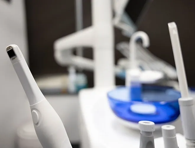 Dental instruments and an intraoral scanner at the chairside.